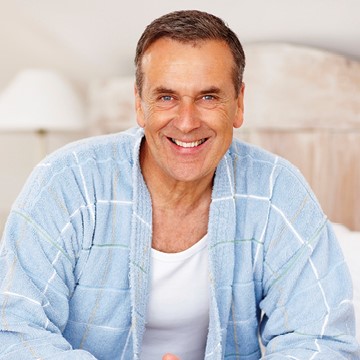 man in robe smiling